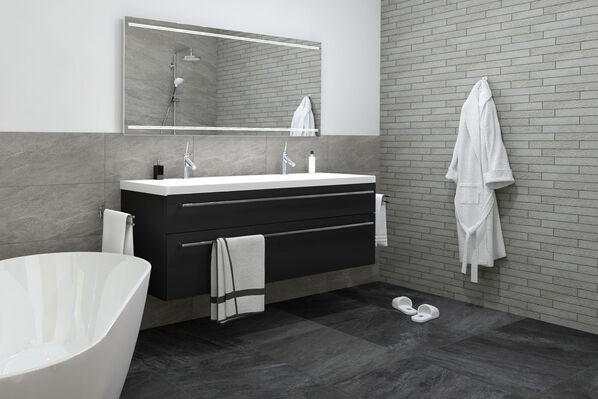 Ausschnitt eines Badezimmers mit dunkelgrauen Fliesenboden (Ceramicvision N-Stone, in der Farbe Slate) und grauen Wandfliesen (Ceramicvision N-Stone Light Grey).